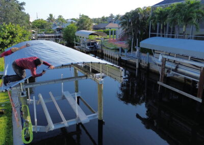 Coastline Team Member Installing Boat Lift Cover