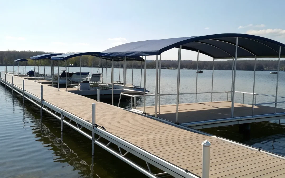 A boat dock with several canopy options for protecting boats from sun and weather.